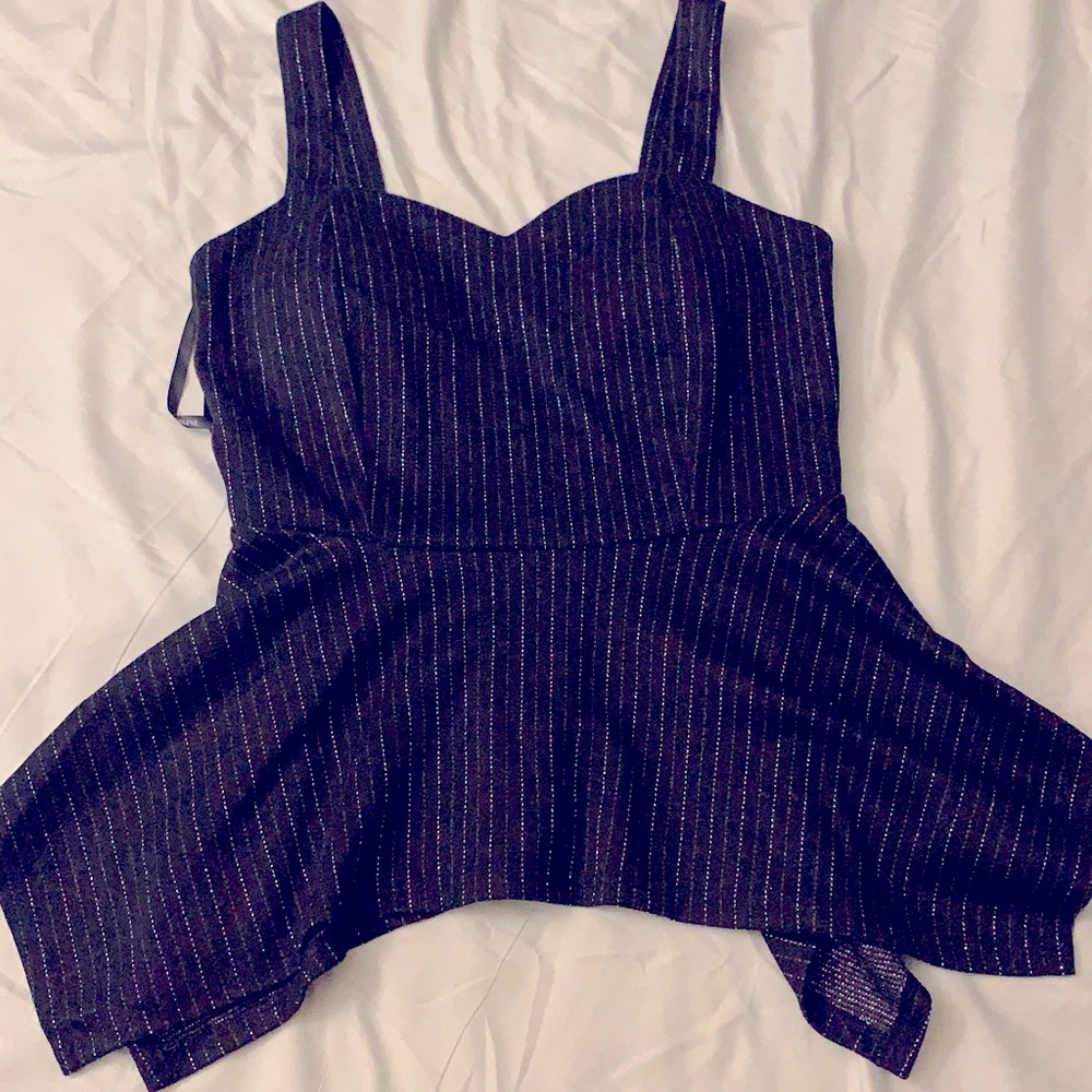 Black corset style crop top with strap and frills perfect for a party!